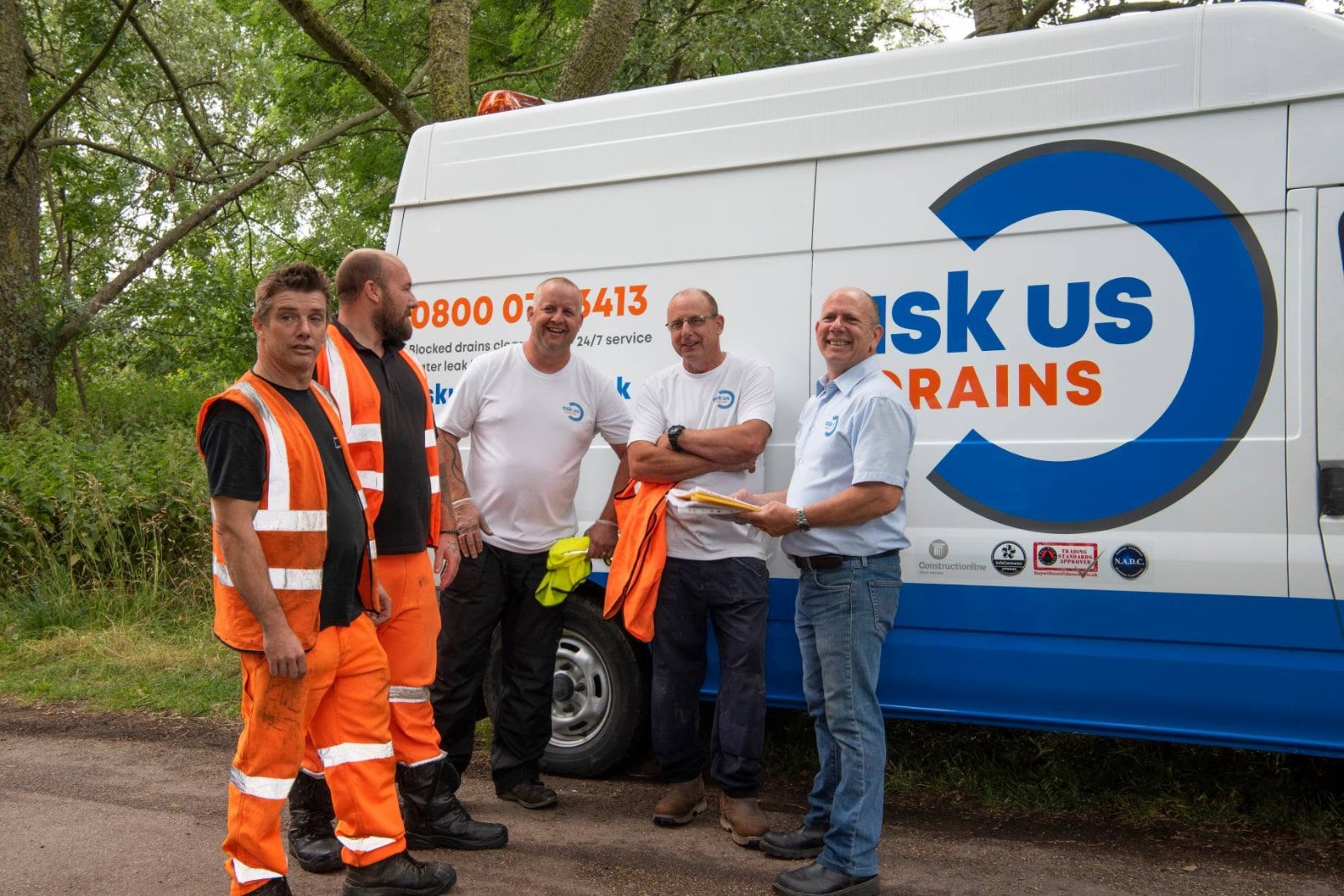 Clear Drains 4 U drainage engineering team in front of livery van across Essex