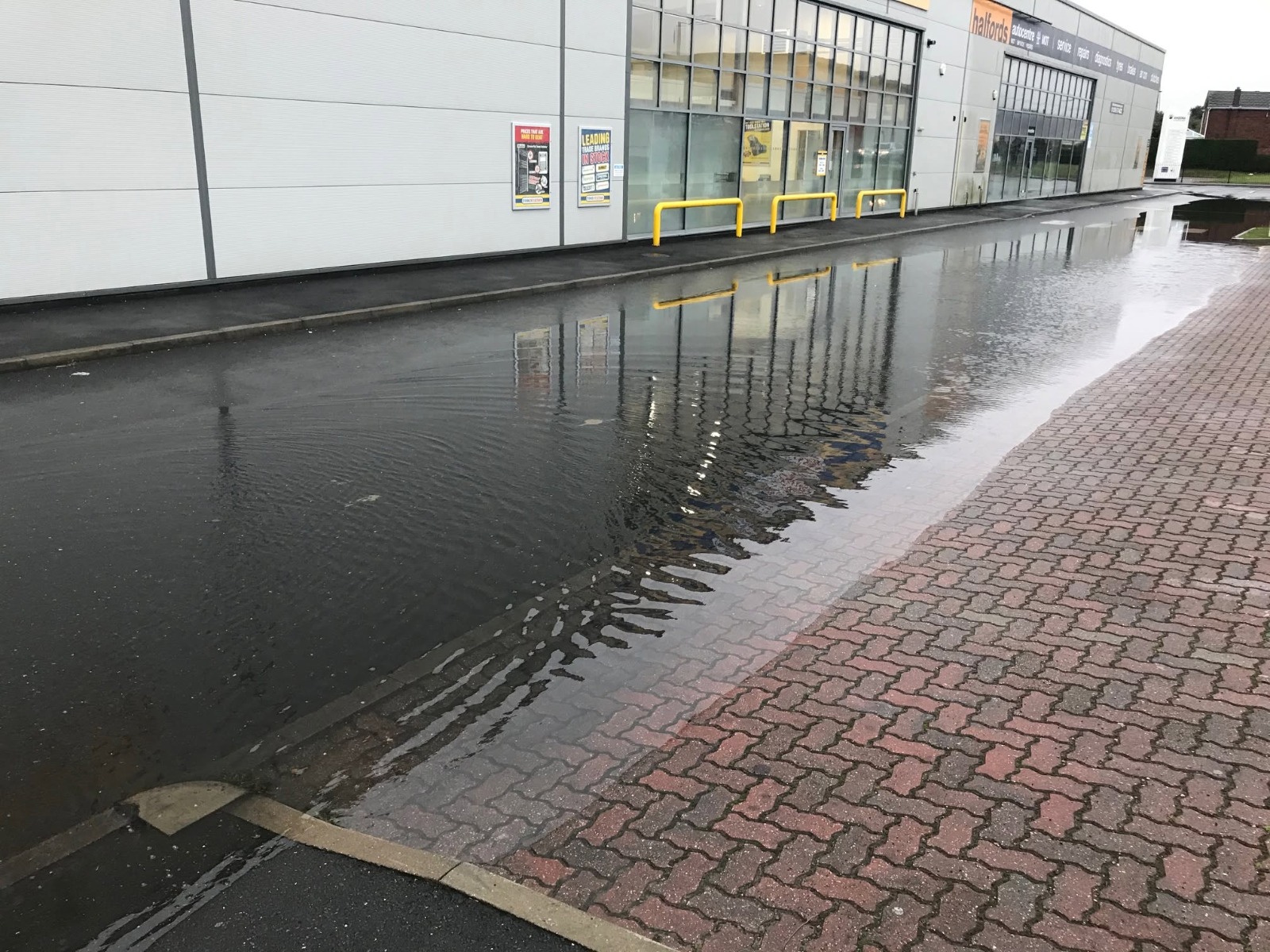 Commercial car park in Essex flooded by blocked surface-water drains — emergency drain unblocking call-out