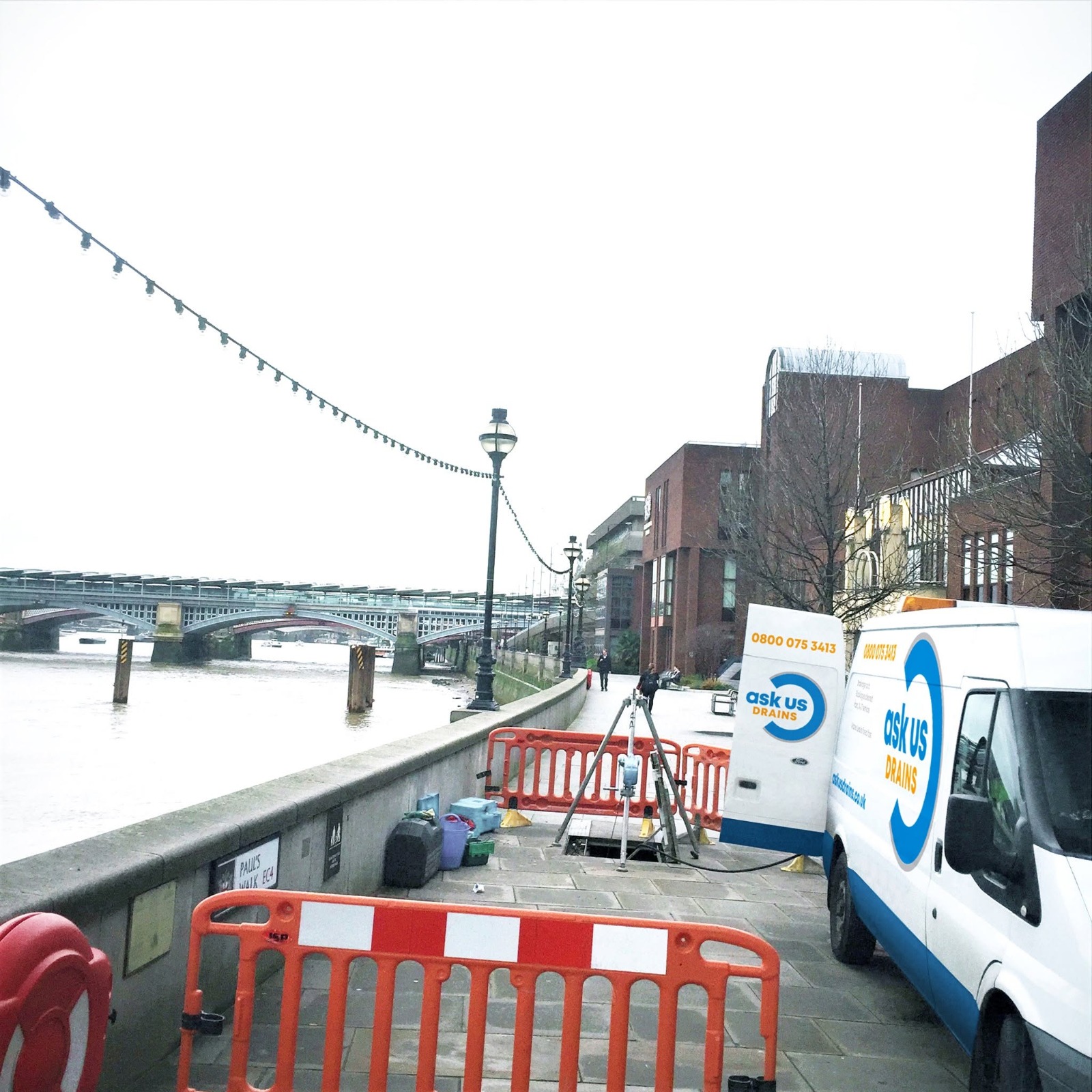 Drainage van and manhole tripod on a job beside the River Thames in central London
